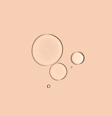 A few drops of Zombie Cell Clarifying Serum on a neutral background